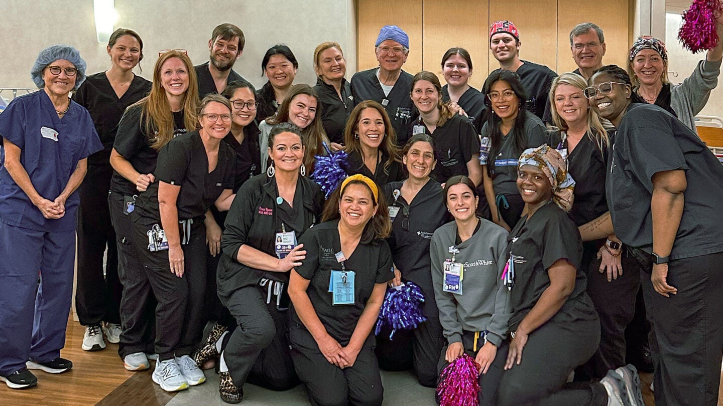 Dr. Robert T. “Bob” Gunby Jr. celebrates with colleagues and care team members following his final delivery before retiring. 